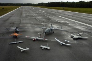 "Group photo of aerial demonstrators at the 2005 Naval Unmanned Aerial Vehicle Air Demo" by U.S. Navy photo by Photographer’s Mate 2nd Class Daniel J. McLain. 